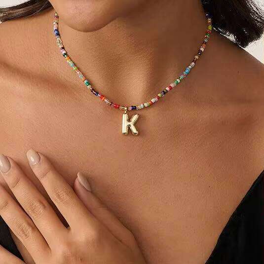 DHcollections Hot Selling Bohemian Colorful Rice Bead Bubble Letter Handcrafted Beaded Beach Necklace for Women
