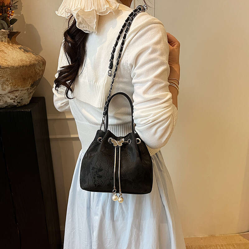 National Style Embossed Bucket New Drawstring Niche Design Women's Shoulder Versatile Chain Crossbody Bag For Outings
