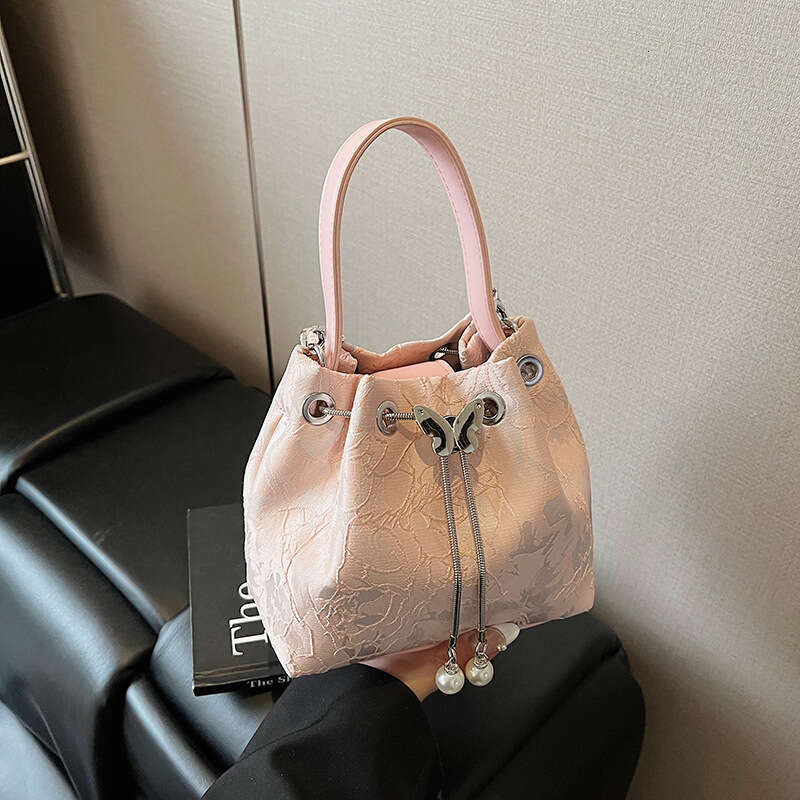 National Style Embossed Bucket New Drawstring Niche Design Women's Shoulder Versatile Chain Crossbody Bag For Outings