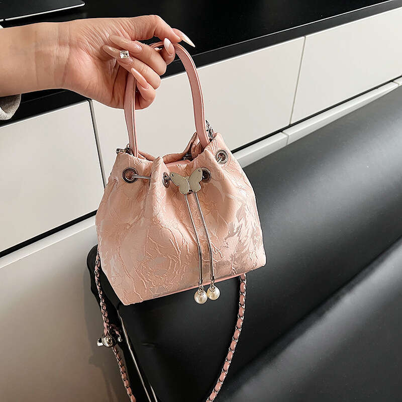 National Style Embossed Bucket New Drawstring Niche Design Women's Shoulder Versatile Chain Crossbody Bag For Outings