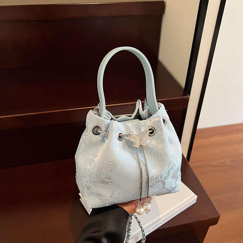 National Style Embossed Bucket New Drawstring Niche Design Women's Shoulder Versatile Chain Crossbody Bag For Outings