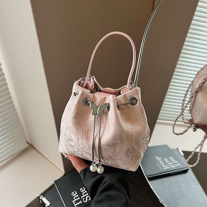 National Style Embossed Bucket New Drawstring Niche Design Women's Shoulder Versatile Chain Crossbody Bag For Outings