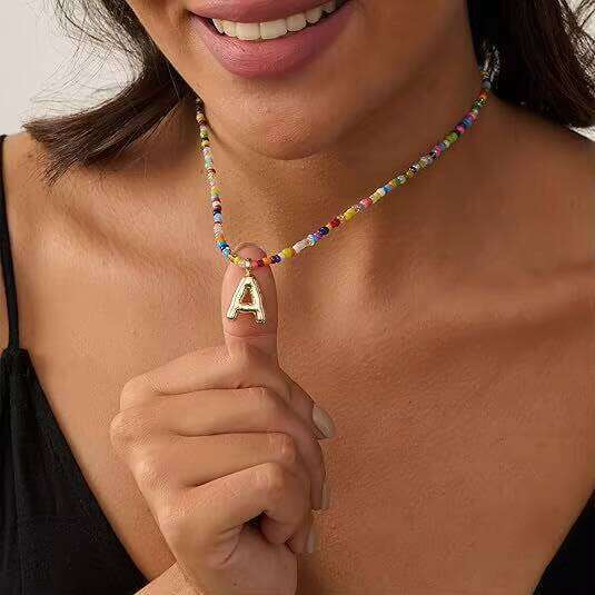 DHcollections Hot Selling Bohemian Colorful Rice Bead Bubble Letter Handcrafted Beaded Beach Necklace for Women