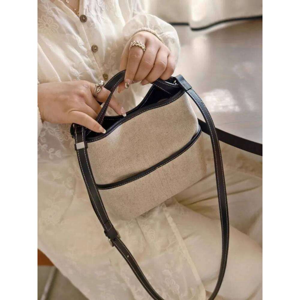 Summer Women Office Designer Totes Handbag Cow Leather Spliced Canvas Bucket Shoulder Underarm Casual Holiday Beach Bag 2025/06/10