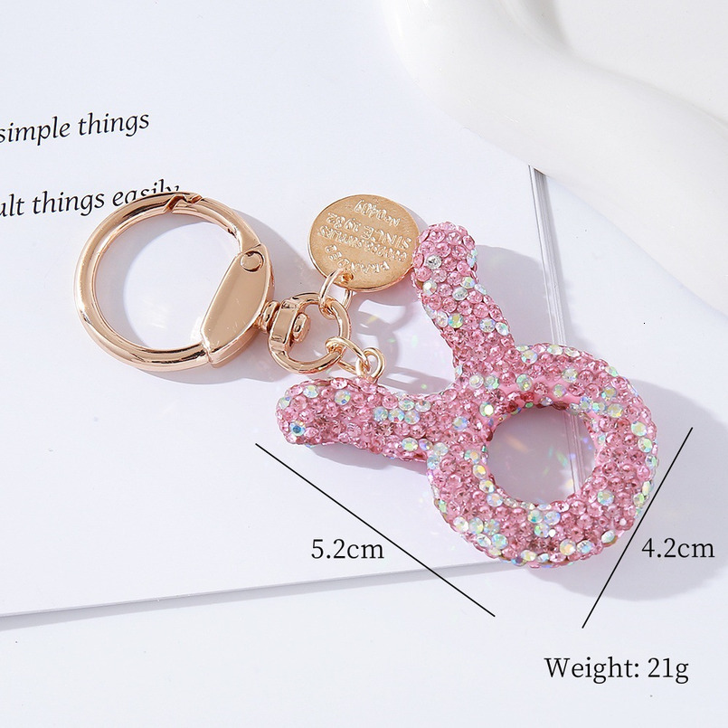 Pink rhinestone constellation car keychain, fashionable, individual and shiny handbag, special constellation pendant for car birthday gifts