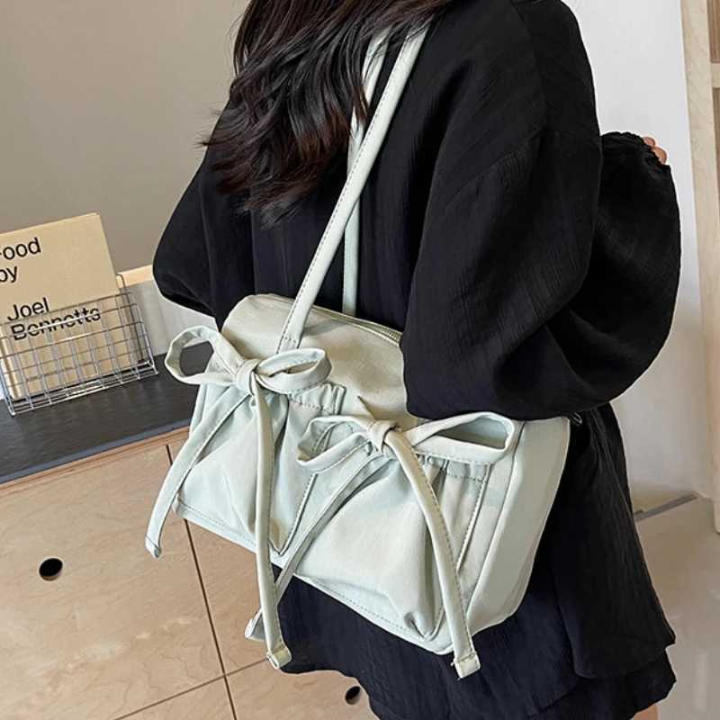 2025 New Korean Bow Nylon Shoulder Bag Fashionable and Sweet Design Tote Bag Folded Large Capacity Commuter Womens Handbag XJ250610