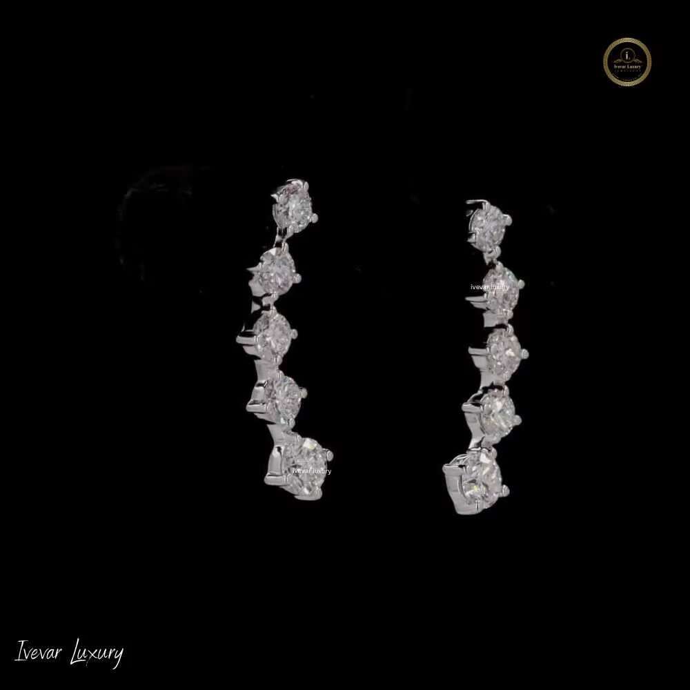 Sophisticated Feminine Accessory: Lustrous Sterling Silver Round Moissanite Solitaire Studs