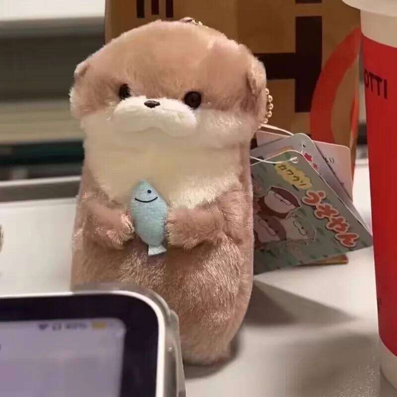 Free shipping Little Otter Hug Fish Plush Doll Cute Girl Heart Keychain Pendant Creative Gift