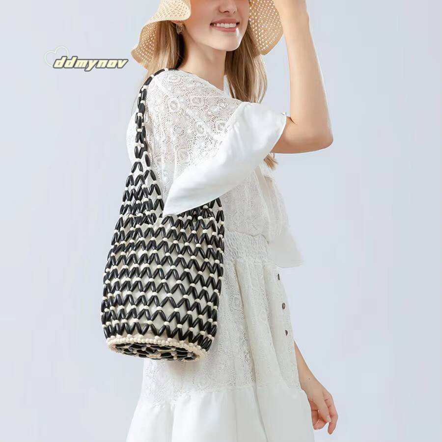 Women Woven hand summer design hollow-out wooden bead tote bucket shoulder bag female Reticulate netted canvas beach handbag ddmynov