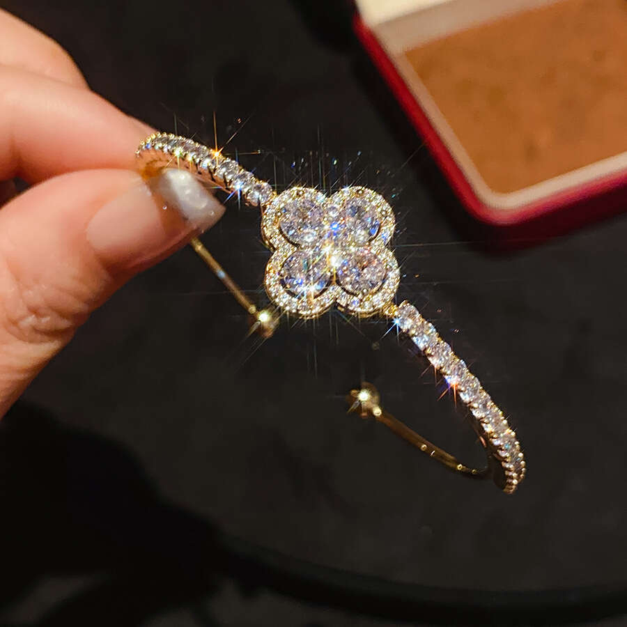 2025 New Luxury Jewelry Designer Bracelet Cross border European and American Zircon Four petal Flower Blossoming Bracelet Light Luxury High end Trendy