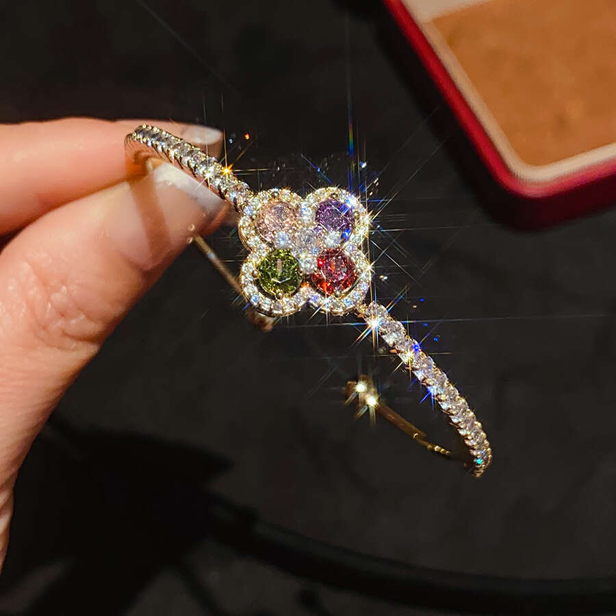 2025 New Luxury Jewelry Designer Bracelet Cross border European and American Zircon Four petal Flower Blossoming Bracelet Light Luxury High end Trendy