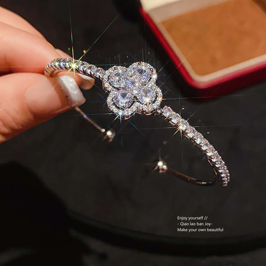 2025 New Luxury Jewelry Designer Bracelet Cross border European and American Zircon Four petal Flower Blossoming Bracelet Light Luxury High end Trendy