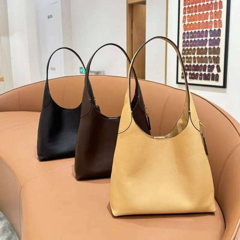 Hot Selling New Women's Simple Large Capacity Tote Versatile Commuting Underarm Single Shoulder Bag Motorcycle Equipment Ac Designer Bags