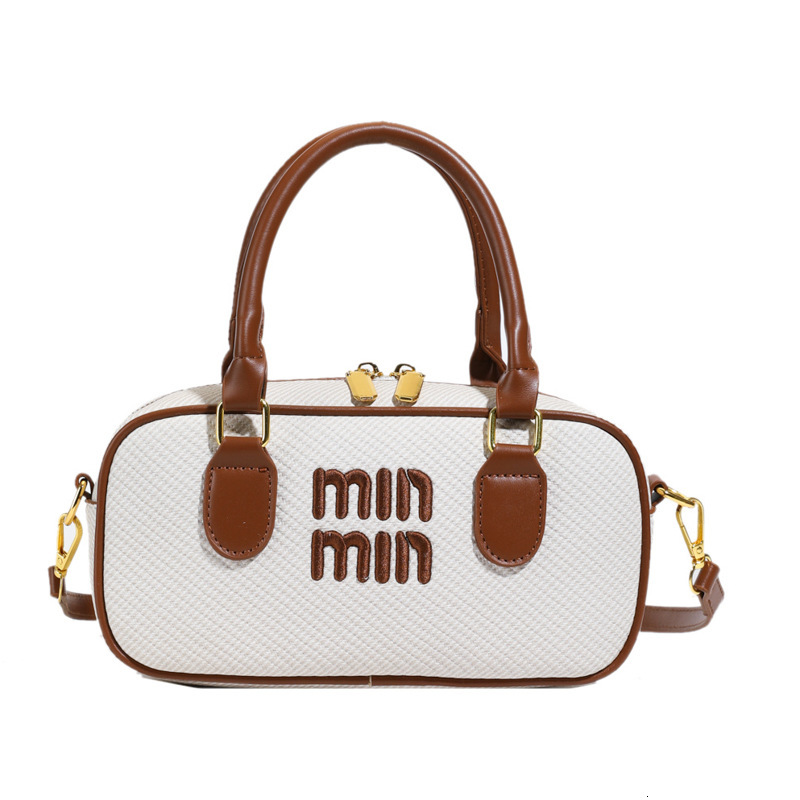 Simple and versatile bags, trendy, casual, fresh and fashionable. Min single shoulder slanted bag, slanted cross hand-held Boston bag, free shipping