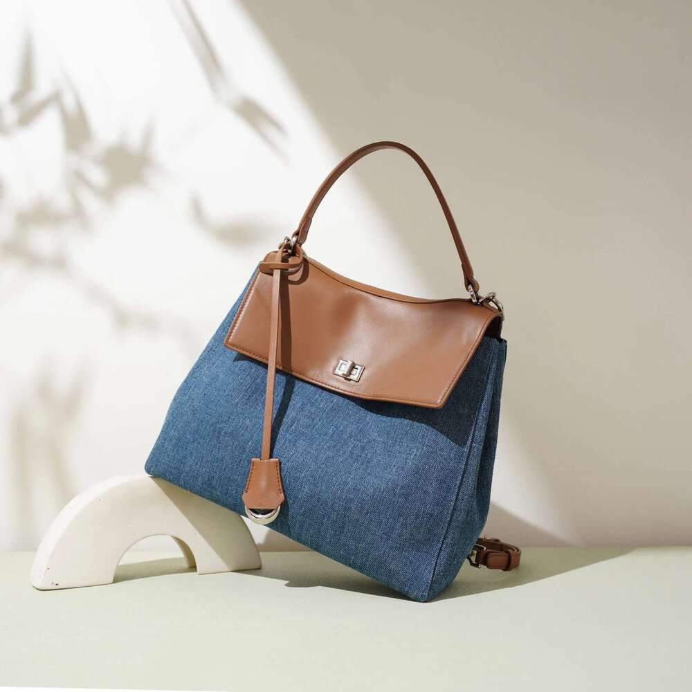 Modern classic design backpack for girls, popular and retro style. Made of denim fabric. Fashionable school bag. Handbag. Backpa