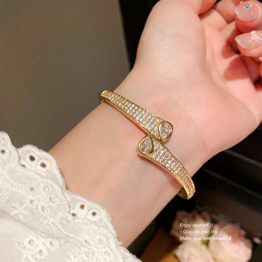 2025 hot designer bracelet 14K Real Gold Plated Zircon Wave Twisted Light High-end Sense Bracelet Niche Design Jewelry for Women