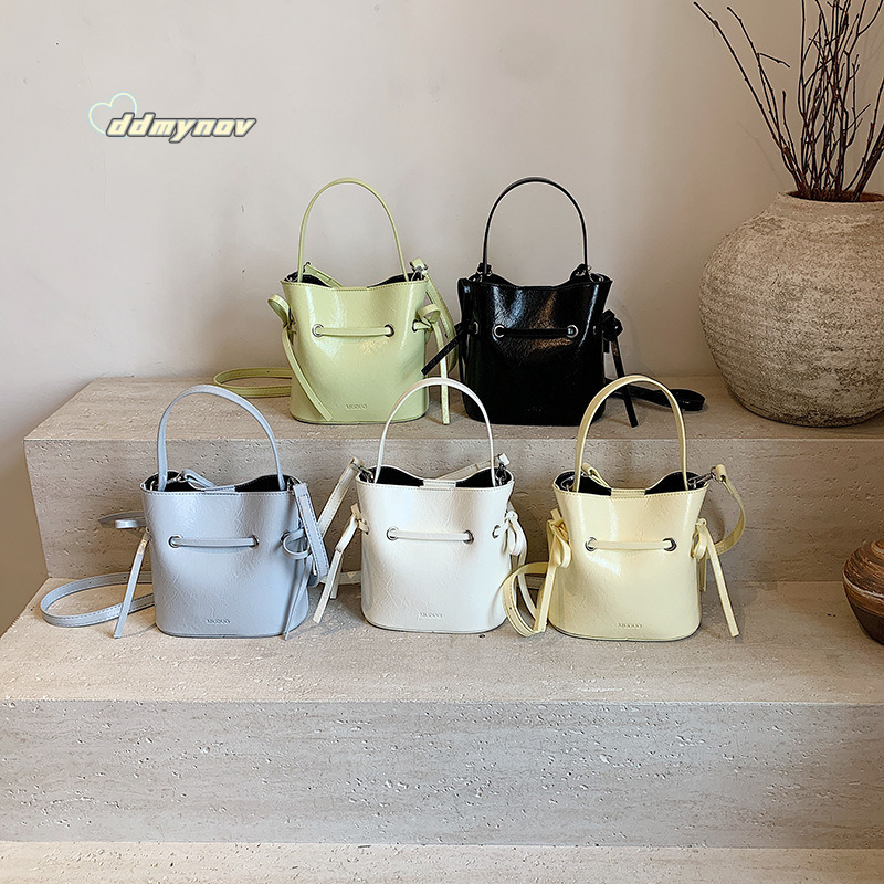 Korean Style Simple Cream Wind Handheld Bucket for Women 2025 Summer New Fashion Trend Versatile Shoulder Crossbody Bag ddmynov ddmynov ddmynov