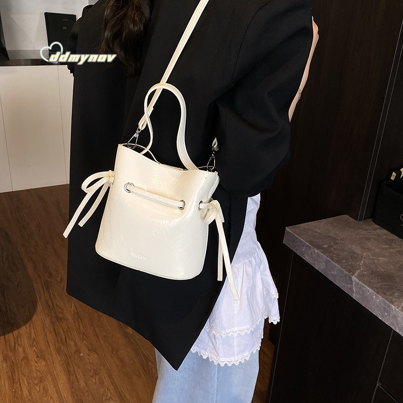 Korean Style Simple Cream Wind Handheld Bucket for Women 2025 Summer New Fashion Trend Versatile Shoulder Crossbody Bag ddmynov ddmynov ddmynov