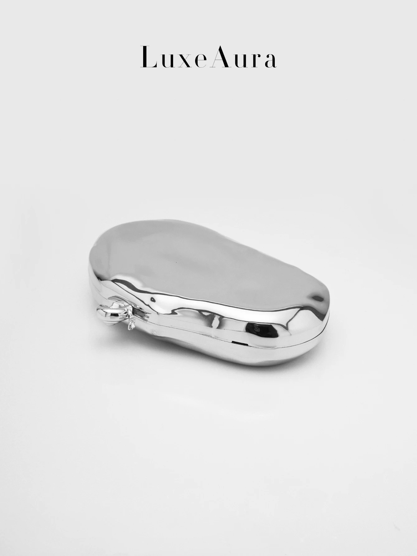 MirrorLike Metallic HardShell Oval Box Bag for Women Featuring a Shiny Textured Design Reminiscent of Vintage ChainHandl 250614