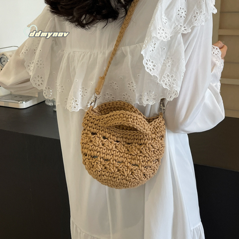 2025 New Large Capacity Women's Artistic Handwoven Hollow Bucket Beach Simple Crossbody Bag ddmynov