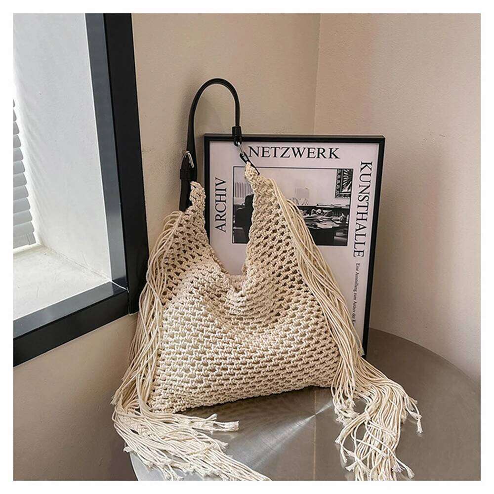 Women's Spring New Simple Hollow Woven Bohemian Tassels Tote Casual Vacation Style Single Shoulder Beach Bag