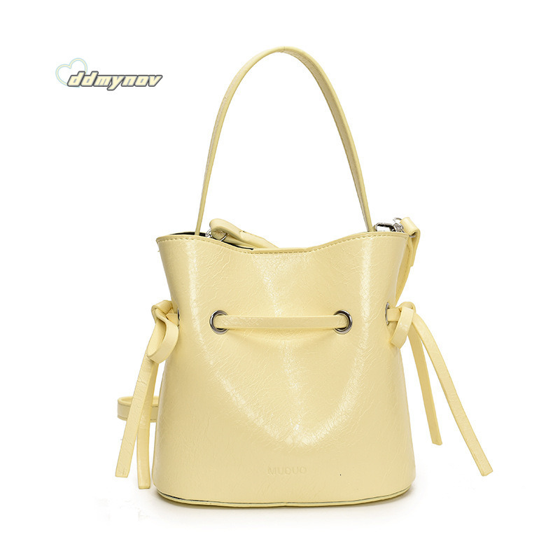 Korean Style Simple Cream Wind Handheld Bucket for Women 2025 Summer New Fashion Trend Versatile Shoulder Crossbody Bag ddmynov ddmynov ddmynov