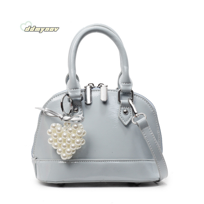 Niche Solid Color Versatile Handheld Shell for Women 2025 Spring Summer New Small Exquisite Fashion Single Shoulder Crossbody Bag ddmynov ddmynov