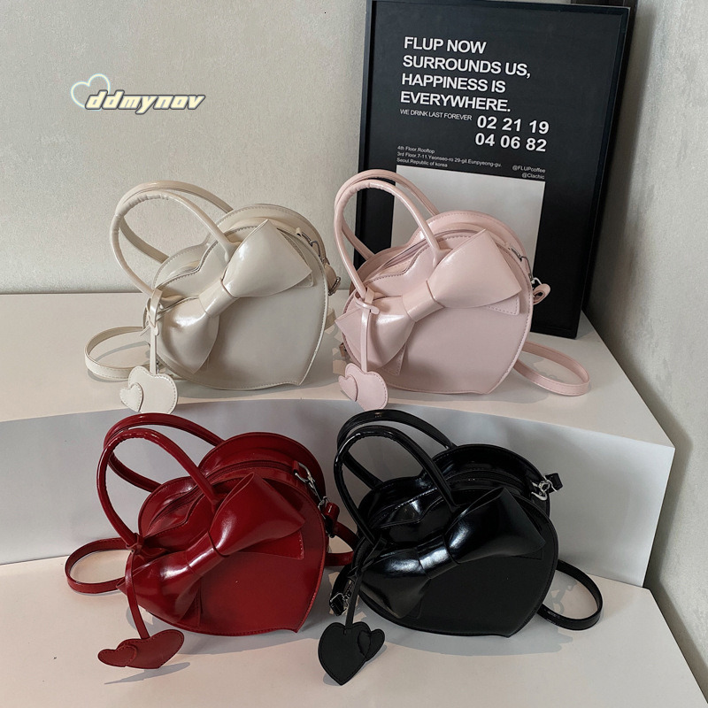2025 New Early Spring Cute Niche Bowknot Handbag Heart Women Fashion Stylish Versatile Crossbody Bag ddmynov