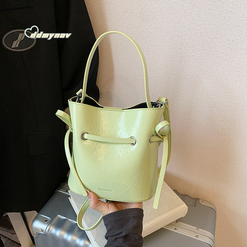 Korean Style Simple Cream Wind Handheld Bucket for Women 2025 Summer New Fashion Trend Versatile Shoulder Crossbody Bag ddmynov ddmynov ddmynov