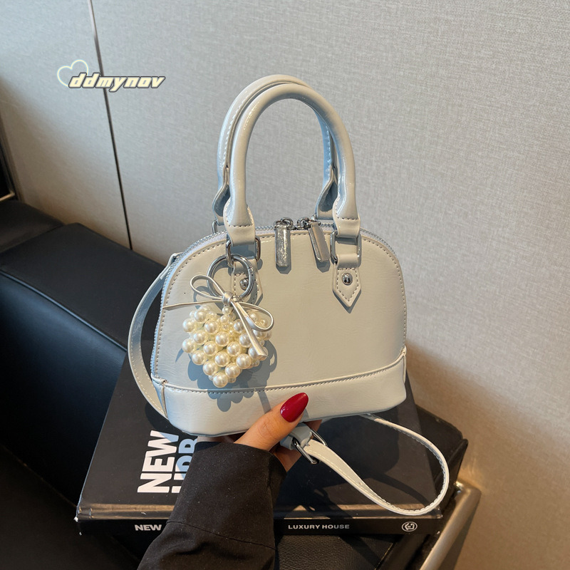 Niche Solid Color Versatile Handheld Shell for Women 2025 Spring Summer New Small Exquisite Fashion Single Shoulder Crossbody Bag ddmynov ddmynov