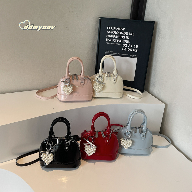 Niche Solid Color Versatile Handheld Shell for Women 2025 Spring Summer New Small Exquisite Fashion Single Shoulder Crossbody Bag ddmynov ddmynov