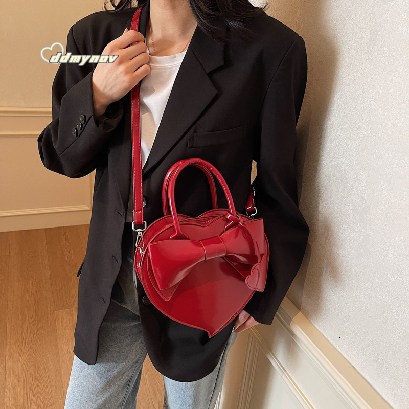 2025 New Early Spring Cute Niche Bowknot Handbag Heart Women Fashion Stylish Versatile Crossbody Bag ddmynov