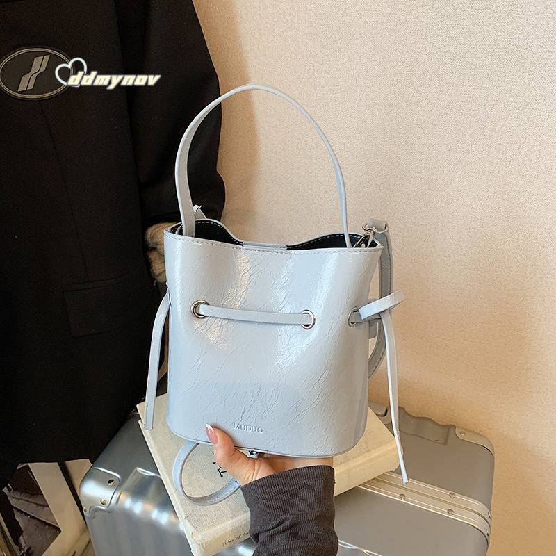Korean Style Simple Cream Wind Handheld Bucket for Women 2025 Summer New Fashion Trend Versatile Shoulder Crossbody Bag ddmynov ddmynov ddmynov