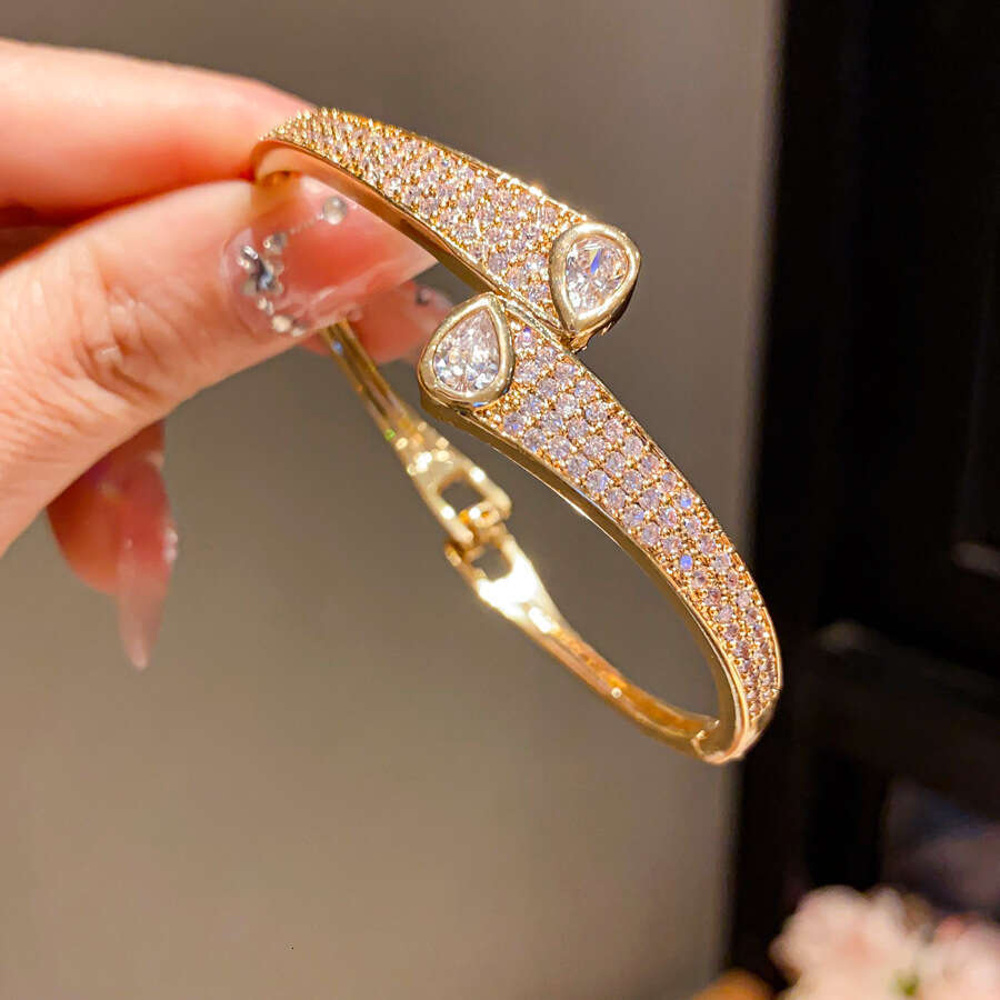 2025 hot designer bracelet 14K Real Gold Plated Zircon Wave Twisted Light High-end Sense Bracelet Niche Design Jewelry for Women