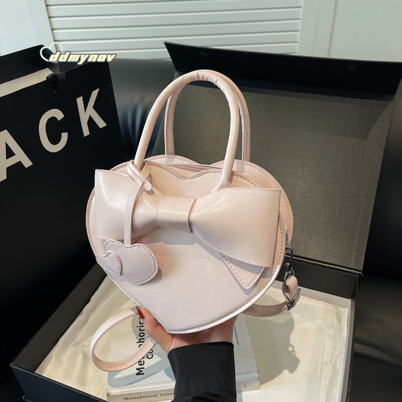 2025 New Early Spring Cute Niche Bowknot Handbag Heart Women Fashion Stylish Versatile Crossbody Bag ddmynov