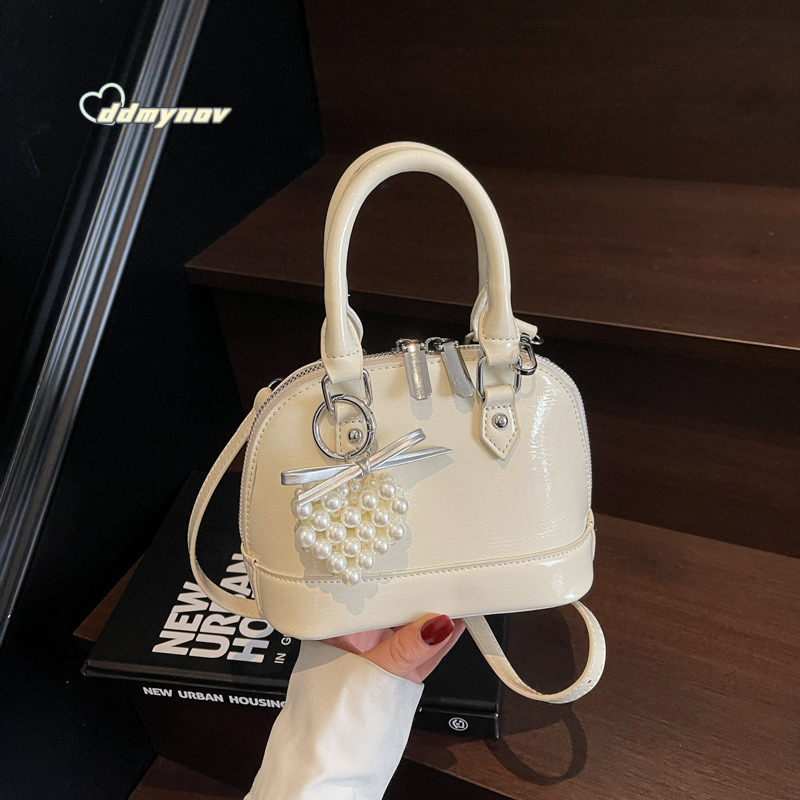Niche Solid Color Versatile Handheld Shell for Women 2025 Spring Summer New Small Exquisite Fashion Single Shoulder Crossbody Bag ddmynov ddmynov