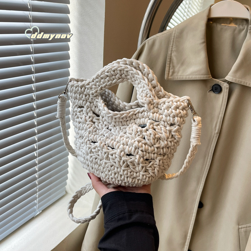 2025 New Large Capacity Women's Artistic Handwoven Hollow Bucket Beach Simple Crossbody Bag ddmynov