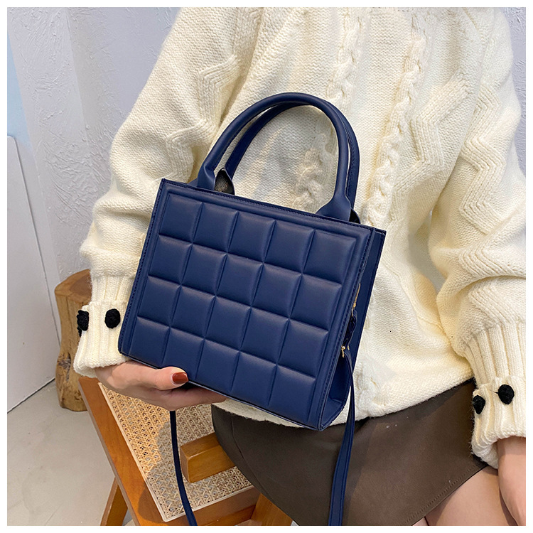 Free Shipping 2025 New Designer Bag Embossed Grid Solid Color Women's Commuting Shoulder Handbag Fashionable High-quality Shopping Bag