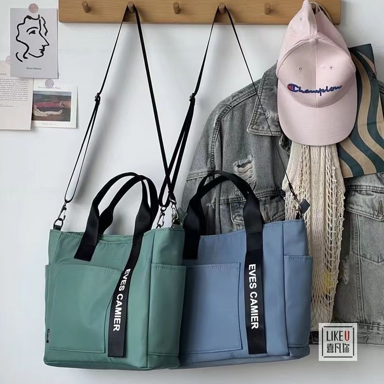 Free Shipping 2025 New Designer Bag Waterproof Canvas Fashion Handbag Simple Multi Functional Shoulder Bag Handheld Leisure High Quality Shopping Bag