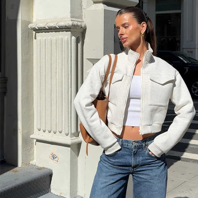 Women's casual fashion European and American style pure color zip-up jacket with pockets and long sleeves for ladies.