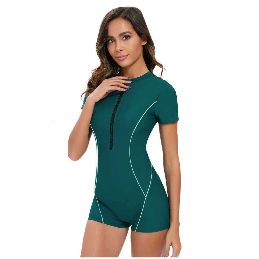 New solid color short sleeved sexy jumpsuit from Europe and America Women's conservative flat angle swimsuit