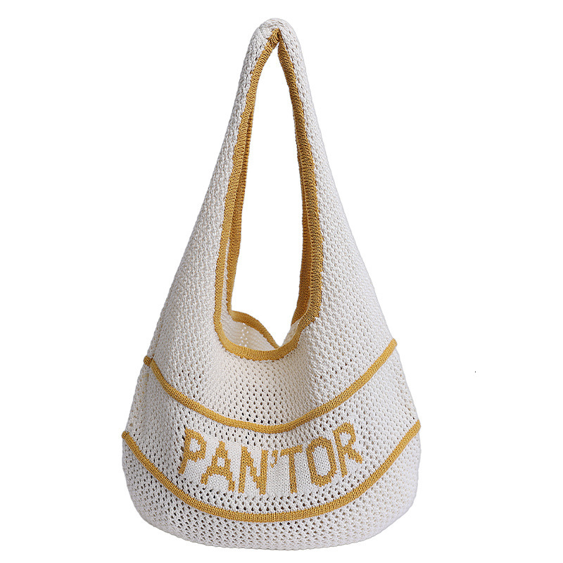 Free shipping designer Woven Bag for Women 2025 Summer New Hollow Design Straw Bag for Beach Commuting Knitted Shoulder Underarm Bag