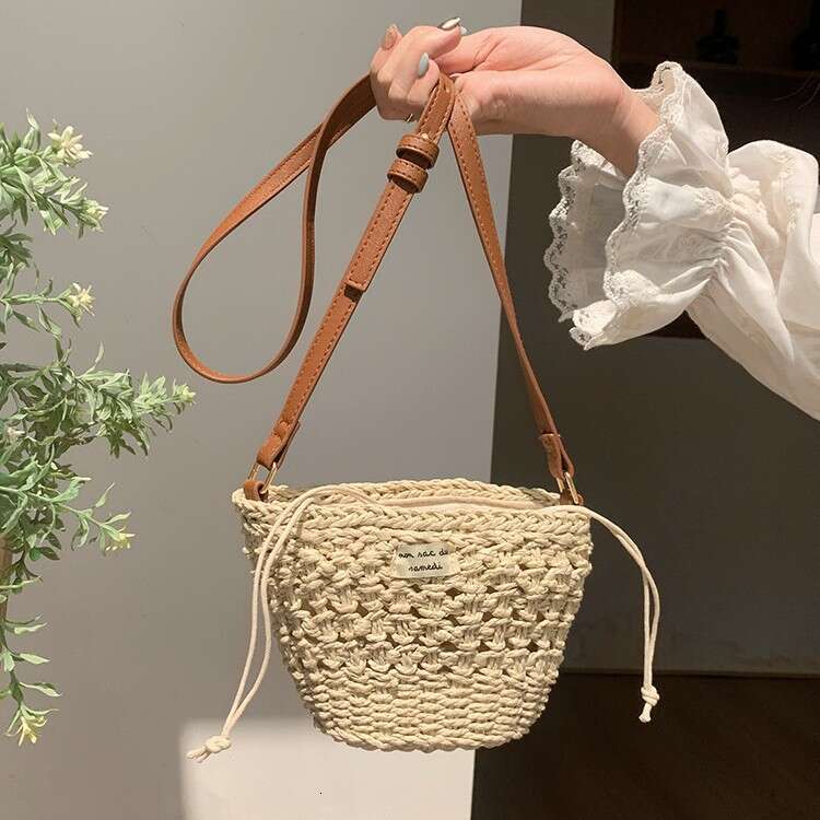 Niche Woven for Women 2025 Summer New Casual Straw Hollow Beach Mini Shoulder Crossbody New Bucket Bag