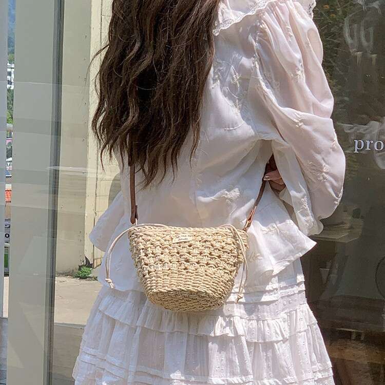 Niche Woven for Women 2025 Summer New Casual Straw Hollow Beach Mini Shoulder Crossbody New Bucket Bag