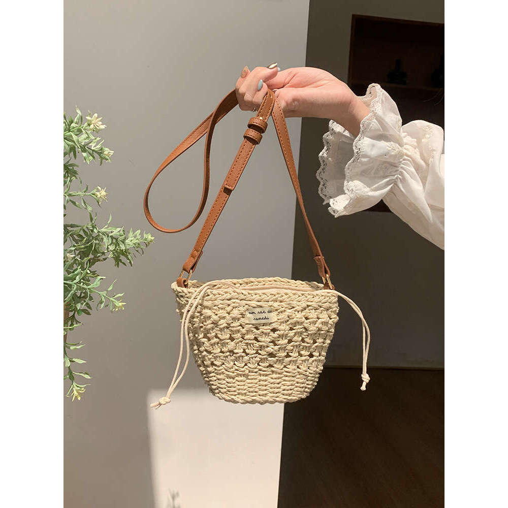 Niche Woven for Women 2025 Summer New Casual Straw Hollow Beach Mini Shoulder Crossbody New Bucket Bag