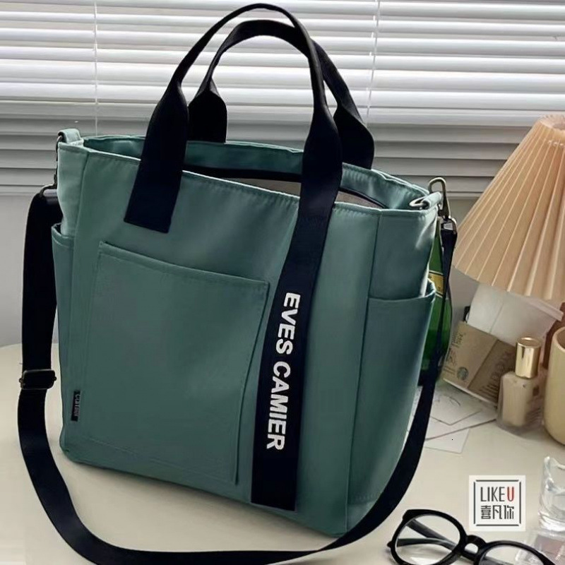 Free Shipping 2025 New Designer Bag Waterproof Canvas Fashion Handbag Simple Multi Functional Shoulder Bag Handheld Leisure High Quality Shopping Bag