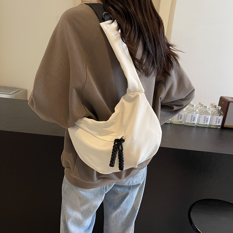 Free shipping designer Casual Versatile Lightweight Canvas Bag New Women Bag Simple Fashion Dumpling Bag Large Capacity Commuter Crossbody Bag