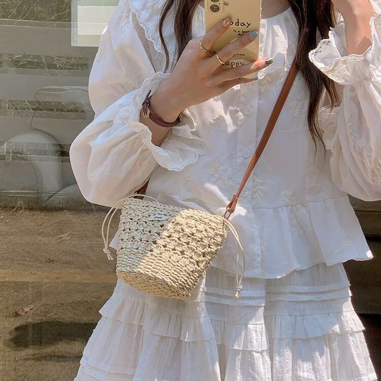 Niche Woven for Women 2025 Summer New Casual Straw Hollow Beach Mini Shoulder Crossbody New Bucket Bag