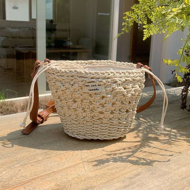Niche Woven for Women 2025 Summer New Casual Straw Hollow Beach Mini Shoulder Crossbody New Bucket Bag