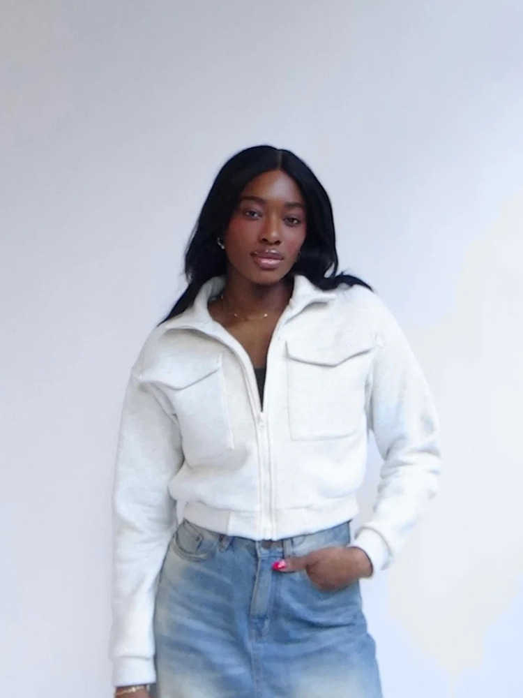 Women's casual fashion European and American style pure color zip-up jacket with pockets and long sleeves for ladies.